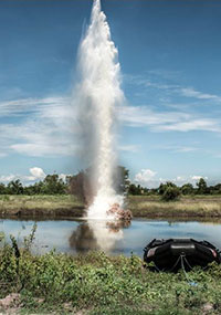 A plume of water shoots into the sky after liquid explosives are detonated underwater A plume of water shoots into the sky after liquid explosives are detonated underwater