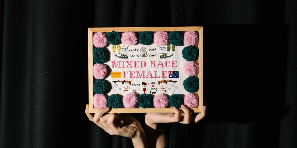 Makeda Duong, Mixed Race Female, 2017, Cotton Cross Stitch, Wool Pompoms, 30.5cm x 23cm x 3cm, Photo credit Morgan Sette
